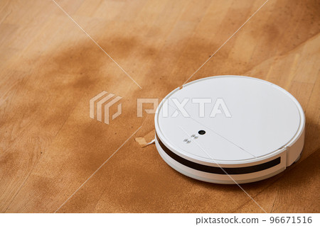 Robot vacuum cleaner cleans the very dirty dusty floor of the apartment at a certain time. Robot vacuum cleaner cleans the very dirty dusty floor of the apartment at a certain time. 96671516