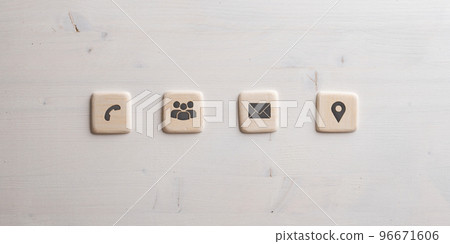 Contact and communication icons on four wooden cut squares Contact and communication icons on four wooden cut squares 96671606