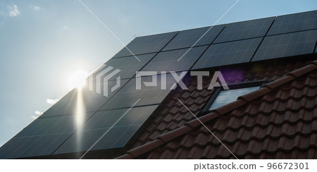 New ecologic house with solar panels Alternative to conventional energy. The battery is charged from a solar cell Advertisement Green energy Sustainable life Renewable  96672301