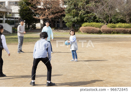 Elementary school students playing dodgeball Elementary school students playing dodgeball 96672845