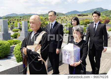 Bereaved family attending the bone-laying ceremony 96674226