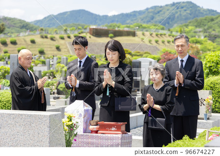 Bereaved family attending the bone-laying ceremony Bereaved family attending the bone-laying ceremony 96674227