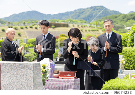 Bereaved family attending the bone-laying ceremony 96674228