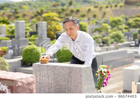 Middle man washing the grave 96674403