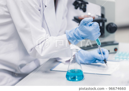 Researcher with petri dish 96674660