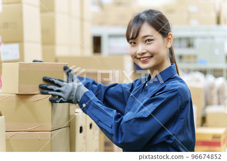 Portrait of a female worker working in a warehouse 96674852