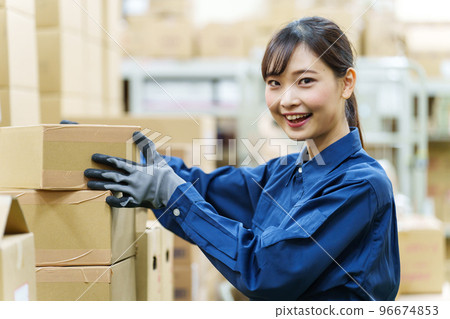 Portrait of a female worker working in a warehouse 96674853