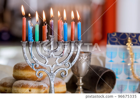 Hanukkah celebration Judaism tradition family religious holiday symbols lighting hanukkiah menorah candles Hanukkah celebration Judaism tradition family religious holiday symbols lighting hanukkiah menorah candles 96675335