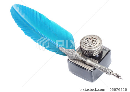 Old blue feather fountain pen with inkwell on white background 96676326
