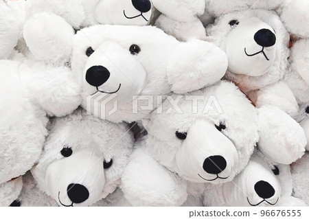 Fuzzy and fluffy cozy soft toy white polar bears closeup, full-frame background 96676555
