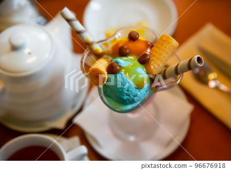 Sweet ice cream dessert in glass bowl 96676918