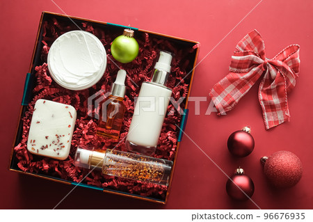 Christmas gift set, xmas holidays beauty box subscription package and luxury skincare products flatlay, cosmetic flat lay on coral background, cosmetics as holiday present or shopping delivery, top 96676935