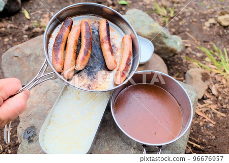 Sausage and curry cooked at the campsite 96676957