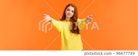 Girl asking come here to give cheer-up hug. Cute and touched tender redhead woman in yellow sweater, extend arms,stretch hands forward for cuddle, embrace friend, smiling lovely, orange background Girl asking come here to give cheer-up hug. Cute and touched tender redhead woman in yellow sweater, extend arms,stretch hands forward for cuddle, embrace friend, smiling lovely, orange background 96677789
