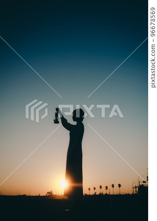 Photo of a young woman with a lantern 96678569