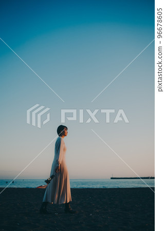 Photo of a young woman with a lantern 96678605