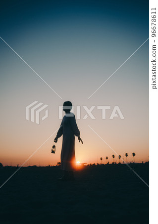 Photo of a young woman with a lantern 96678611