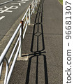 Sun shadow by a road 96681307