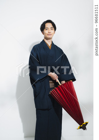 A man in a kimono, a Japanese umbrella A man in a kimono, a Japanese umbrella 96681511