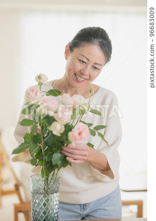 Middle woman image decorating flowers 96683009