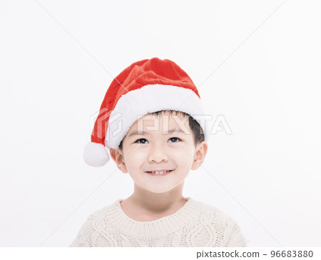 Happy little boy dressed in christmas Santa hat Happy little boy dressed in christmas Santa hat 96683880
