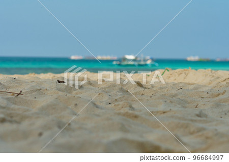Boracay, Philippines - Jan 30, 2020: Empty White beach of Boracay island in the daytime. No Chinese tourists because of the coronavirus. Boats in the sea carry tourists. 96684997