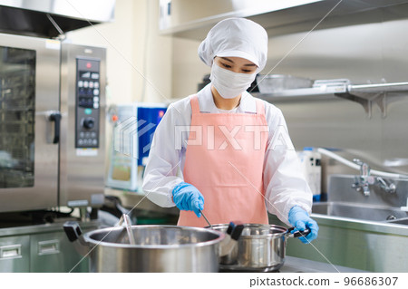 young female cook young female cook 96686307