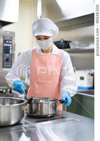 young female cook 96686308