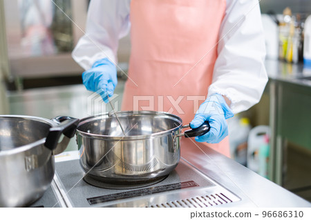 young female cook young female cook 96686310