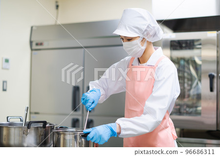young female cook young female cook 96686311