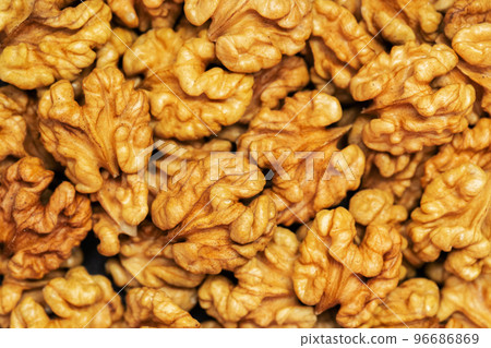 Walnuts background. Kernels walnuts. Top view. Vegetarian or healthy food Walnuts background. Kernels walnuts. Top view. Vegetarian or healthy food 96686869