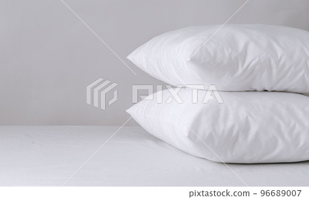 two comfortable pillows, white bed linen, no one there. Bed linen, home comfort, free space. Good morning in daylight 96689007