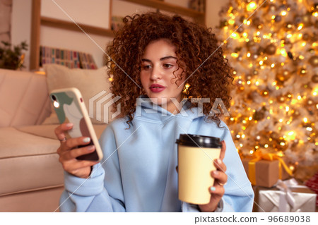 woman eating sushi, asian food restaurant, romantic evening, eating sushi with chopsticks, sushi delivery and takeout, eating at home, romantic dinner alone in christmas decor. Eve New year, saving woman eating sushi, asian food restaurant, romantic evening, eating sushi with chopsticks, sushi delivery and takeout, eating at home, romantic dinner alone in christmas decor. Eve New year, saving 96689038