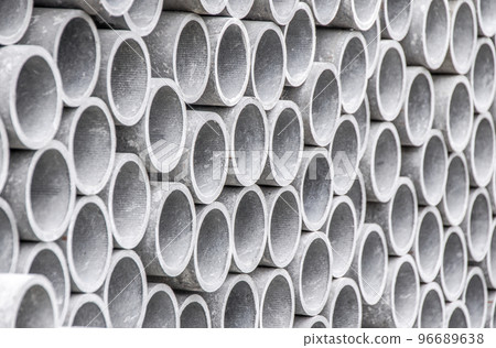 Closeup of asbestos pipes on construction site. Closeup of asbestos pipes on construction site. 96689638