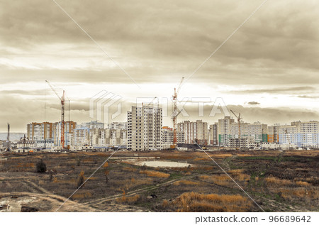 Cranes and new modern residential buildings Cranes and new modern residential buildings 96689642