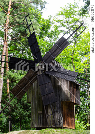 An old wooden mill in a Ukrainian village. Historical building in the forest close-up 96692073
