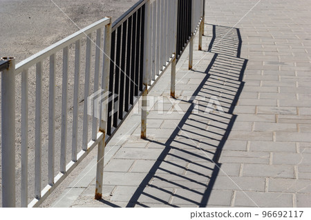 Handrail by road. Pedestrian barrier. Fence along road. Fencing details 96692117