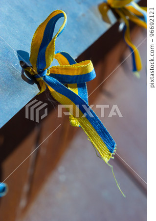 Ribbons with yellow and blue colors of Ukraine during a peaceful demonstration against war, Putin and Russia, Ukrainians, the color of the flag of Ukraine 96692121