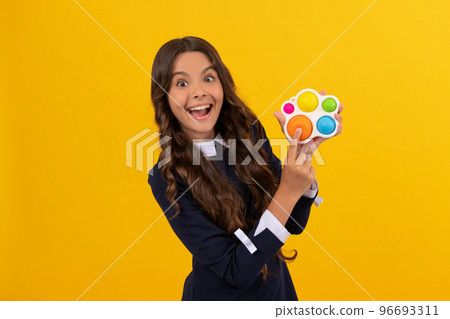 surprised kid play with popit or simple dimple silicone sensory fidget toy, simple dimple 96693311