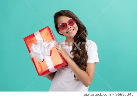 fashionable happy kid in sunglasses hold gift box, discount 96693343