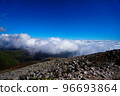 A mountain trail where you can go through rolling rocks and stones under the sea of clouds 96693864