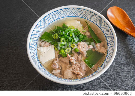 Meat soup with tofu on black background 96693963