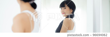 Beautiful young asian woman looking body in mirror with belly figure slim at home. Beautiful young asian woman looking body in mirror with belly figure slim at home. 96694062
