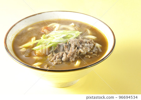 Hot curry udon with green onions and beef 96694534
