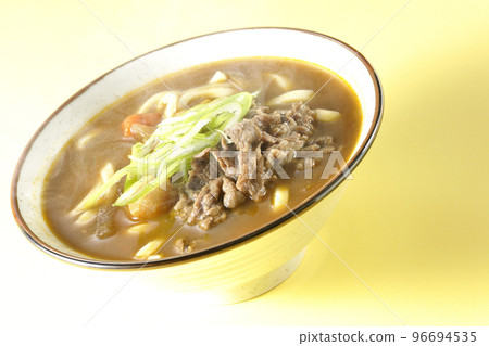 Hot curry udon with green onions and beef 96694535