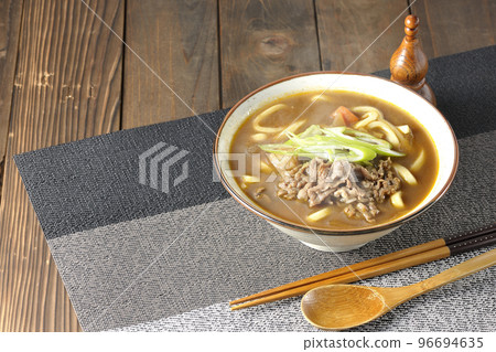 Hot curry udon with green onions and beef 96694635