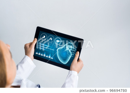Close of female doctor hands working with tablet pc computer 96694780