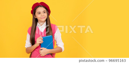 happy teen school girl in french beret hold copybook on yellow background, literature. Banner of school girl student. Schoolgirl pupil portrait with copy space. 96695163