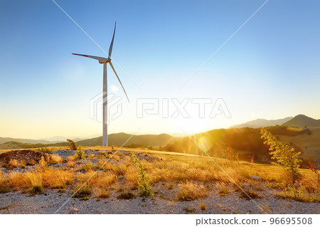 View of power stations for renewable electric energy production. Windmill on sunny summer day. High wind turbine for generation electricity. 96695508