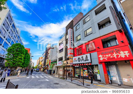 Tokyo's Chiyoda Ward, Kanda Surugadai's urban landscape, a shopping street along Meikei Dori Tokyo's Chiyoda Ward, Kanda Surugadai's urban landscape, a shopping street along Meikei Dori 96695633